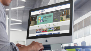 iMac computer displaying Plano, Texas website